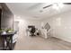 Open bonus room with neutral tones, a ceiling fan, and versatile space for recreation and relaxation at 16632 W Jenan St, Surprise, AZ 85388
