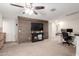 Bonus room with wood accent wall and views into another room - ideal for a flexible living space at 16632 W Jenan St, Surprise, AZ 85388