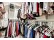 Spacious walk-in closet with ample hanging space and built-in shelving for optimal organization at 16632 W Jenan St, Surprise, AZ 85388