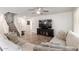 Bright living room with tile flooring, comfortable seating, and an open floor plan at 16632 W Jenan St, Surprise, AZ 85388