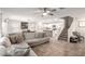 Bright living room with tile flooring, comfortable seating, and an open floor plan at 16632 W Jenan St, Surprise, AZ 85388