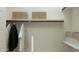 Organized walk-in closet with ample shelving, hanging space, and neutral tones providing efficient and stylish storage solutions at 16934 W Bronco Trl, Surprise, AZ 85387