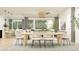 Open-concept dining area featuring a modern table, comfortable seating, and a seamless transition to the living space at 16934 W Bronco Trl, Surprise, AZ 85387
