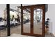 A modern gym with people on treadmills and exercise equipment, viewed through glass doors at 16934 W Bronco Trl, Surprise, AZ 85387