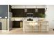 Contemporary kitchen featuring modern appliances, an island with seating, and stylish pendant lighting for a welcoming atmosphere at 16934 W Bronco Trl, Surprise, AZ 85387