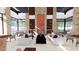 A comfortable lounge area with sofas, chairs, and a fireplace feature at 16934 W Bronco Trl, Surprise, AZ 85387