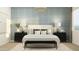 Elegant main bedroom with a stylish bed, chic lighting, and tasteful decor, creating a serene and inviting retreat at 16934 W Bronco Trl, Surprise, AZ 85387