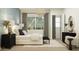 Serene main bedroom featuring a comfortable bed, soft lighting, and calming decor, perfect for relaxation and restful nights at 16934 W Bronco Trl, Surprise, AZ 85387
