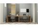 Contemporary office space with dual workstations, natural lighting, minimalist decor, and a calm atmosphere at 16934 W Bronco Trl, Surprise, AZ 85387