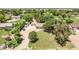 Scenic property with mature trees, ample space for parking, and an ample driveway leading to a charming single-story home at 17730 E Brooks Farm Rd, Gilbert, AZ 85298