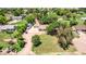 Gorgeous property with mature trees, and an ample driveway leading to a charming single-story home and detached garage at 17730 E Brooks Farm Rd, Gilbert, AZ 85298