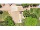 Birds-eye view of house with a large driveway, patio and backyard at 17730 E Brooks Farm Rd, Gilbert, AZ 85298