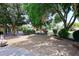 Scenic backyard with patio, fire pit, and view of the red barn at 17730 E Brooks Farm Rd, Gilbert, AZ 85298