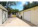 Exterior view of garage, barn structure, and gated area; perfect for rural property at 17730 E Brooks Farm Rd, Gilbert, AZ 85298