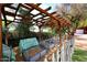 View of garden area with a wooden pergola over raised garden beds, great for growing plants and vegetables at 17730 E Brooks Farm Rd, Gilbert, AZ 85298