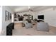 Bright living room showcasing a stone fireplace, neutral decor, and comfortable seating at 17730 E Brooks Farm Rd, Gilbert, AZ 85298