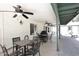 Covered patio with ceiling fans and multiple seating areas, perfect for outdoor entertaining at 17730 E Brooks Farm Rd, Gilbert, AZ 85298
