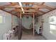 Shed interior with wooden structure, metal roof, and windows; featuring 'Scramble Inn' sign at 17730 E Brooks Farm Rd, Gilbert, AZ 85298