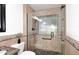 Modern shower with glass enclosure and tiled walls at 17730 E Brooks Farm Rd, Gilbert, AZ 85298