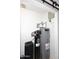 Utility room with a water heater and filtration system at 17730 E Brooks Farm Rd, Gilbert, AZ 85298