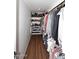 Spacious walk-in closet with custom shelving and racks, perfect for organized storage at 17730 E Brooks Farm Rd, Gilbert, AZ 85298