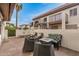An inviting backyard patio with outdoor seating, a fire pit, and a well-kept wall at 1916 W Morningside Dr # 108, Phoenix, AZ 85023