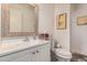 A pristine bathroom with white vanity, framed mirror, and modern fixtures at 1916 W Morningside Dr # 108, Phoenix, AZ 85023