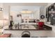 Bright kitchen with white cabinets, sleek black countertops, and modern appliances at 1916 W Morningside Dr # 108, Phoenix, AZ 85023
