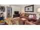 Comfortable living room with stylish decor, large TV, and seamless flow to other living spaces at 1916 W Morningside Dr # 108, Phoenix, AZ 85023