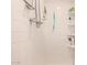 A bright shower area featuring white tiles and a mounted shower head at 1916 W Morningside Dr # 108, Phoenix, AZ 85023