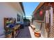 Charming backyard featuring potted plants, gardening table, gravel, wind chimes, and partial shade at 1982 E Oxford Dr, Tempe, AZ 85283