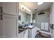 Well-lit bathroom with a modern vanity, stylish fixtures, a spacious mirror, and walk in shower at 1982 E Oxford Dr, Tempe, AZ 85283