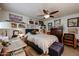 Bedroom featuring a ceiling fan, decorative shelves, and neutral colors, and lots of art at 1982 E Oxford Dr, Tempe, AZ 85283