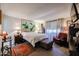 Cozy bedroom featuring a comfortable bed, oriental-themed decor and a window allowing natural light at 1982 E Oxford Dr, Tempe, AZ 85283
