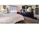 Bright bedroom with a bed, dresser with mirror, and soft natural light at 1982 E Oxford Dr, Tempe, AZ 85283