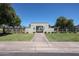 Community entrance with well-manicured lawns, mature trees, and a gated entrance at 1982 E Oxford Dr, Tempe, AZ 85283