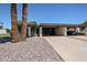 Charming home exterior featuring mature landscaping and a spacious covered carport for convenient parking at 1982 E Oxford Dr, Tempe, AZ 85283