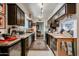 Efficient kitchen with dark wood cabinets, stainless steel appliances, and ample counter space at 1982 E Oxford Dr, Tempe, AZ 85283