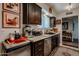 Modern kitchen featuring stainless steel appliances, dark wood cabinets, and granite countertops at 1982 E Oxford Dr, Tempe, AZ 85283