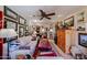 Inviting living room with a ceiling fan, comfortable seating, and eclectic art gallery display at 1982 E Oxford Dr, Tempe, AZ 85283