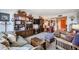 Spacious living room featuring a large sofa, wooden furniture, decorative shelving, and an inviting atmosphere at 1982 E Oxford Dr, Tempe, AZ 85283