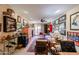 Cozy living room with a ceiling fan, eclectic decor, and access to an outdoor patio area at 1982 E Oxford Dr, Tempe, AZ 85283