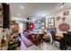 Cozy living room with a ceiling fan, eclectic art, and access to a dining area at 1982 E Oxford Dr, Tempe, AZ 85283