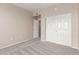 Bedroom featuring neutral carpet, a closet, and a door leading to another room at 20100 N 78Th N Pl # 3212, Scottsdale, AZ 85255