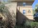 View of the home's exterior, showing its architecture, with trees and shrubs, and multiple windows at 20100 N 78Th N Pl # 3212, Scottsdale, AZ 85255