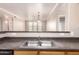 Open kitchen with a stainless steel sink and dark countertops overlooking the living area at 20100 N 78Th N Pl # 3212, Scottsdale, AZ 85255