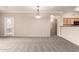 Spacious carpeted living area featuring an open layout, perfect for entertaining or relaxing with natural lighting at 20100 N 78Th N Pl # 3212, Scottsdale, AZ 85255
