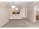 Open-concept living area with neutral paint, carpeted floors, and modern lighting, adjacent to the kitchen at 20100 N 78Th N Pl # 3212, Scottsdale, AZ 85255