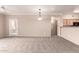 A spacious carpeted living area blending seamlessly with an open floorplan, featuring access to the outside at 20100 N 78Th N Pl # 3212, Scottsdale, AZ 85255