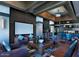 Stylish lounge area with comfortable seating, a large screen, and modern decor for relaxation and socializing at 20100 N 78Th N Pl # 3212, Scottsdale, AZ 85255